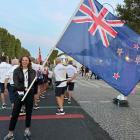 Dunedin athlete Anna Grimaldi carries the flag for the New Zealand team at the Paralympics...