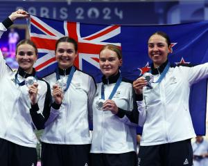 Silver medallists (from left) Ally Wollaston, Bryony Botha, Emily Shearman 
...