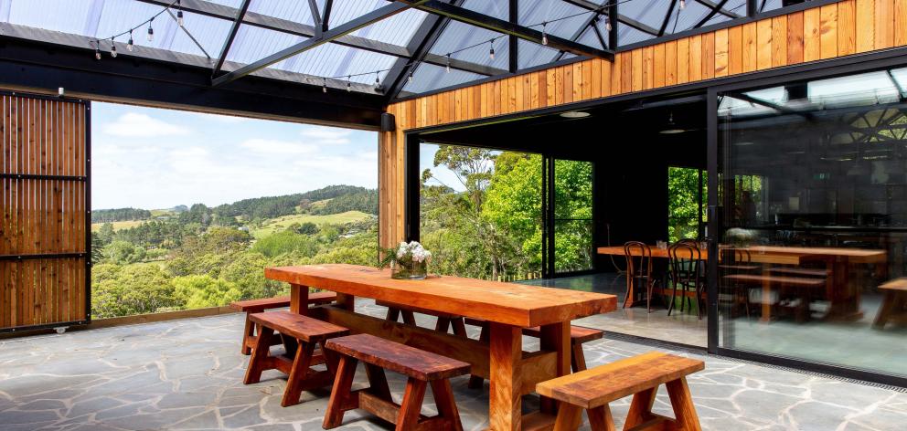 The school is housed in a modern, barn-like structure with vaulted ceilings.