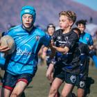 Whakatipu Rugby Club’s Callum Longthorn, 12, puts on a burst of speed to shake off Sumner club...