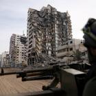 An Israeli soldier sits in a Humvee amid the ongoing ground operation of the Israeli army against...