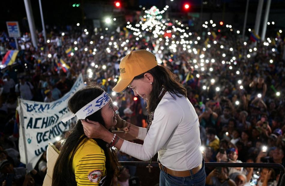 Venezuelan opposition leader Maria Corina Machado attends a rally, despite not being able to run...