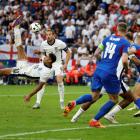 Jude Bellingham scored with a spectacular last-minute overhead kick to rescue England and send...