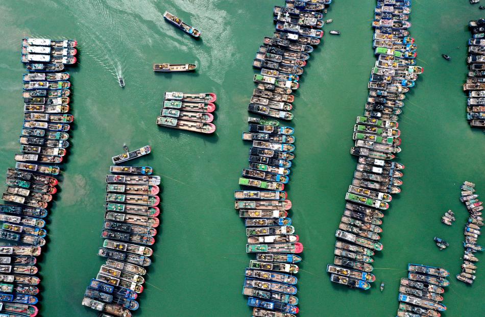 Fishing boats are moored at a port as Typhoon Gaemi approaches, in Lianjiang county, Fuzhou, China.