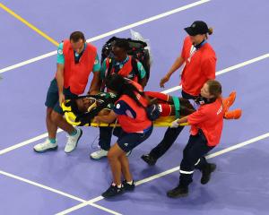 Ethiopia's Lamecha Girma was taken to hospital after falling heavily in the steeplechase. Photo:...