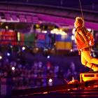 Actor Tom Cruise jumps from the roof of the Stade de France during the closing ceremony. Photo:...