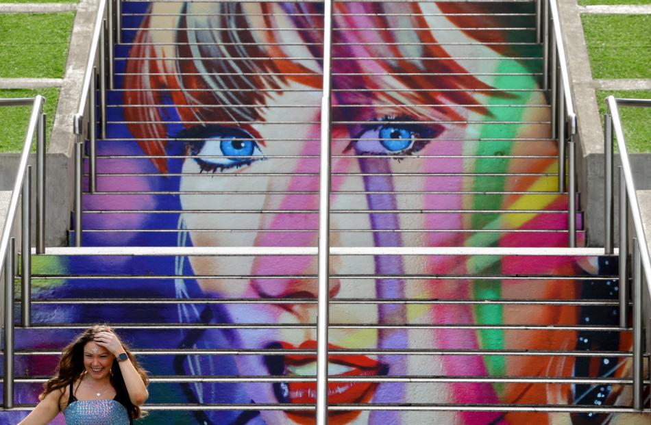 A person descends the "Swiftie Steps" ahead of a Taylor Swift concert, at Wembley Stadium in London.