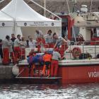 Rescuer lift the a bag containing the body of British entrepreneur Mike Lynch who owned the...