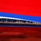 Participants hold a large-size Russian state flag during celebrations of National Flag Day, in...