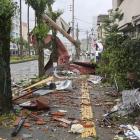 Debris and objects blown by strong winds caused by Typhoon Shanshan are seen in Miyazaki,...