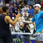 Botic van de Zandschulp (right) shakes hands with Carlos Alcaraz after his second round match win...