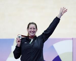 New Zealand's Anna Taylor celebrates with her silver medal on the podium. Photo: Reuters 