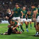 Grant Williams dives over to score the winning try for South Africa. Photo: Reuters