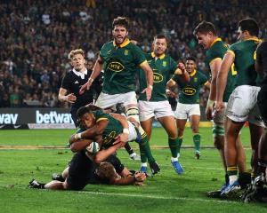 Grant Williams dives over to score the winning try for South Africa. Photo: Reuters