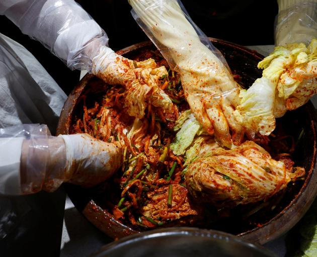 Lee Ha-yeon, a recognized kimchi grand master and her apprentices prepare kimchi at the Kimchi...