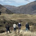 Looking over the proposed new Hogan Gully golf course earlier this year are (from left) course...