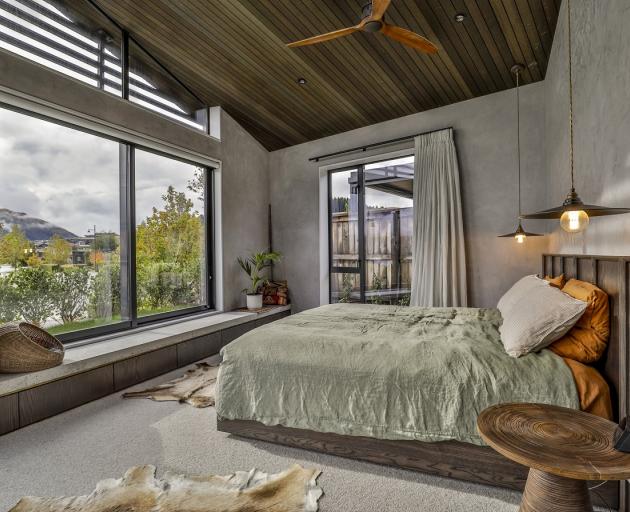 The main bedroom, like the living area, enjoys the best of the views.