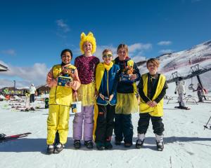 Paint the peak yellow... Hitting the slopes at Coronet Peak on Daffodil Day are (from left)...