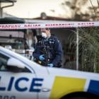 Police guard the scene of an Auckland murder. PHOTO: NZ HERALD