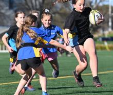 Valerie Beatson, 11, of Anderson’s Bay School, tries to beat the Strath Taieri defence. PHOTOS:...