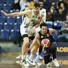 Franklin Bulls centre Sam Timmins and Otago Nuggets import Zaccheus Darko-Kelly chase a loose...