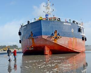 The Manahau may be stuck in the sand for days. Photo: Damer Farrell, Greymouth Star
