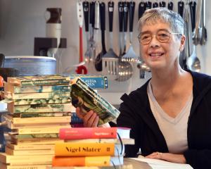 Charmian Smith with some of her cookbooks. PHOTO: PETER MCINTOSH