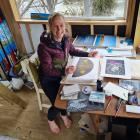 Albert Town artist Chrissy Wickes prepares art for her upcoming talk and exhibition on the...