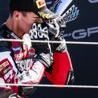 Southland motorcycle rider Cormac Buchanan hugs his trophy after finishing third in race two at...