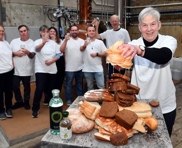 Sue Stockwell wrings out a loaf as Dunedin Craft Distillers celebrate saving 10tonnes of bread...