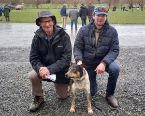 Kevin Johnston (left), of Edievale, meets his new dog Chopper, which he bought for $400 in the...