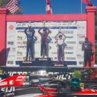 Alex Crosbie (right), of Invercargill on the podium after finishing third in the second race of...