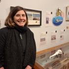 Artist Angela Railton with a ceramic inspired by the albatross skull. It is one of the 42 pieces...