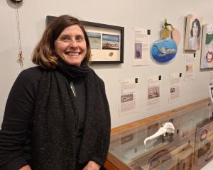 Artist Angela Railton with a ceramic inspired by the albatross skull. It is one of the 42 pieces...