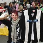 Tania Keane, of Dunedin, shows her haul at the fundraiser for the Otepoti Dunedin Whanau Refuge....