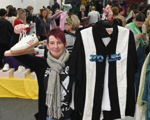 Tania Keane, of Dunedin, shows her haul at the fundraiser for the Otepoti Dunedin Whanau Refuge....