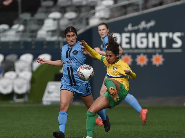 Dunedin City Royals captain Rose Morton (left) tries to defend the pass of Cashmere Technical...