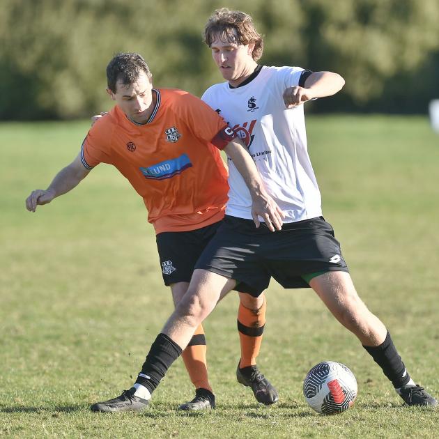 Cameron McPhail (Northern, left) and Joshua Marshall (Roslyn-Wakari) compete for possession at...