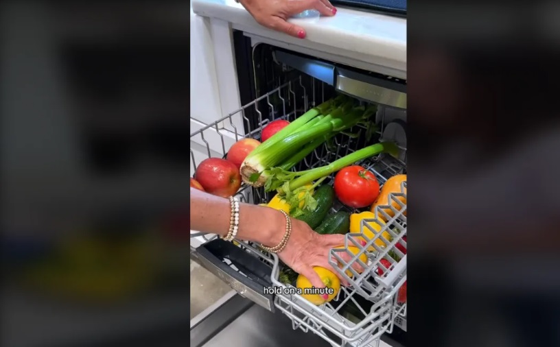 Screenshot from a video on TikTok of a person washing fruit and vegetables in a dishwasher. Photo...