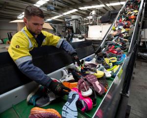 Shoes are recycled at Fast Feet Grinded, the world's first shoe recycling factory processing...