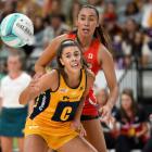 Dakota Thomas (rear) in action for the Swifts against the Lightning on the Gold Coast last year....