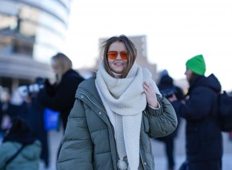 A guest wears a full-length khaki puffer jacket during the Copenhagen Fashion Week earlier this...