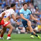 Luke Metcalf of the Warriors passes during an NRL preseason match against the Dolphins at Mt...