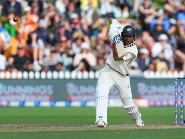 New Zealand’s Rachin Ravindra dispatches a drive on day three of the first test against Australia...