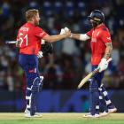 England's Jonny Bairstow and Phil Salt celebrate their victory over West Indies in Gros Islet,...