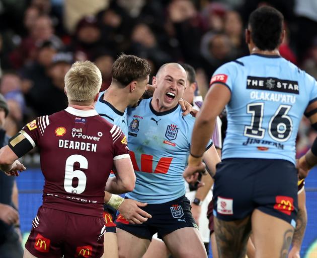 Dylan Edwards of the Blues celebrates after scoring a try in game two of State of Origin at the...