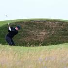 Rory McIlroy attempts a shot out of one of Royal Troon's cavernous bunkers. Photo: Getty Images