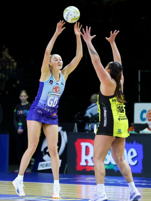 Carys Stythe of the Northern Mystics (left) competes against Central Pulse's Tiana Metuarau at a...