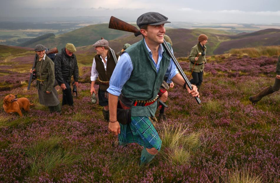 A shooting party take part in the opening day of the grouse-shooting season, in the Lammermuir...