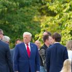 Donald Trump attends a wreath laying ceremony at Arlington national cemetery on Monday. Photo:...